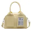 Moda Brillante de Primavera 2025 Cara Brillante Color Sólido Coreano Bolso Boston Portátil Diseño de Nicho Bolso de Hombro Cruzado