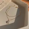 Pulsera de perlas vintage de Corea del Sur estilo ins femenino nicho pulsera de acero de titanio pulsera de pareja joyería de mano venta al por mayor