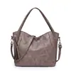 Popular bolsa de cuero suave para el trabajo de comercio exterior con un tacto de alta gama, simple y versátil, bolso de hombro cruzado, bolsa de mano grande para mujer