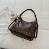 Bolsa de Ombro Lisa Nova Outono 2026 Bolsa Tote para Trabalho e Deslocamento Bolsa Transversal Casual com Personalidade Grande Capacidade Tendência