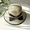 Sombrero femenino verano estilo coreano lazo grande sombrero de paja de playa viaje vacaciones protección solar sombrero para el sol sombrero de paja tejido estilo Chanel tipo cubo