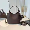 Bolso tipo cubo nuevo de textura para principios de otoño 2026, alto valor estético, color liso, bolso de mano pequeño exquisito para salir, ir al trabajo, bolso cruzado