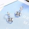 Pendientes de moda con hebilla de oreja de amor y temperamento para mujer, diseño elegante y moderno, con circonita blanca de alta calidad y diamantes europeos y americanos.