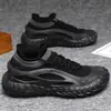 Zapatos de hombre tejidos voladores explosiones transfronterizas moda nueva primavera y verano todo partido zapatos deportivos casuales mocasines slip-on de moda
