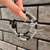 Pulseira de obsidiana prateada natural e ágata azul com design de laço duplo, simples e original, popular para homens e mulheres, pulseira de contas de oração budista para casais
