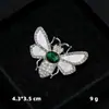 Broche de concha de imitación de diamante, alfiler de perla anti-luz de nicho, alfiler de ramillete de aleación, en stock, accesorios de ropa al por mayor