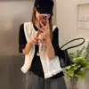 Conjunto de camiseta de manga corta versátil y elegante estilo coreano para el verano + chaleco de encaje para mujer 2026, atuendo sencillo de dos piezas