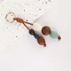 Colgante de Bolsa con Cuentas de Cerámica de Colores Tejido a Mano Piedra Cuentas de Madera Colgante de Bolsa Longxiang Accesorios de Llavero de Moda