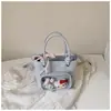 Bolso bandolera de un solo hombro fresco y dulce estilo coreano, nuevo modelo principios de otoño 2026, alto valor estético, único, bolso tipo cubo de gran capacidad para llevar en la mano