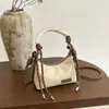 Bolso de hombro tejido con asa para mujer, modelo nuevo 2026, transfronterizo, bolso cruzado de diseño nicho, ligero y versátil para el día a día