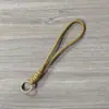 Cordão curto para celular com nó em duas cores, cordão trançado à mão para garrafa de água, alça de pulso para capa de celular, cordão de pulso removível