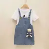 Conjunto de dos piezas de falda con tirantes de mezclilla para niñas, conjunto de verano moderno y a la moda para bebés, traje casual de manga corta para niños