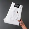 Jeans Negros de Gama Alta de Nueve Puntos para Hombre Pantalones Ajustados Moda Europea Modernos de 9 Puntos Verano Delgados de Moda Marca