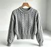 Sitio web independiente ropa de mujer transfronteriza tops 2026 otoño tejido retorcido entallado al cuerpo suéter corto estilo corto de manga larga con cuello redondo otoño e invierno