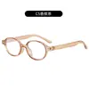 Nuevas Gafas de Marco Ovalado Retro para Mujer Personalidad Artística Lentes Planos Simples Decoración de Remaches Clásica Montura de Espejo Lisa