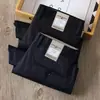 Pantalones casuales de primavera y verano para hombre, corte recto fino, antiarrugas, sin planchado, Tencel algodón, negocios, alta gama, elástico, pantalones negros