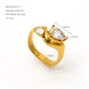 Anillo doble de acero inoxidable estilo francés vintage europeo y americano con textura retorcida en oro brillante y circón marquesa, un accesorio de alta gama para el día a día
