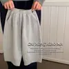 Pantalones infantiles de primavera y otoño para niñas y niños 2025 versión coreana nuevos pantalones deportivos pantalones largos holgados pantalones casuales