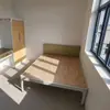 Perfil cama individual apartamento dormitorio cama individual de hierro hotel dormitorio cama de hierro se puede procesar bajo pedido sin ruido anormal