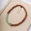 Pulsera multicírculo de madera de durazno DIY jade Dongling anillo giratorio temperamento de texto fresco pequeño pulsera para hombres y mujeres fabricantes mayoreo