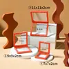 Caja colgante de película de PE de color de moda, película transparente, a prueba de polvo, para exhibir y empaquetar monedas, joyas y otros coleccionables