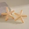 Pendientes de acero con tachuelas de estrella de mar plisadas estilo metálico transfronterizos europeos y americanos, pendientes únicos y de moda con un toque de nicho de alta gama, accesorios de oreja exagerados