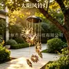 Luz de carillón de viento solar transfronteriza para jardines y céspedes exteriores, luz colgante de carillón de viento ahuecado de luna y estrellas para patios de villas