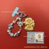 Llavero de tela con logo de empresa personalizado Cadena para teléfono móvil Angela Lámina de oro puro Oro 999 Regalo de aniversario
