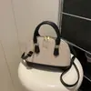 Parche Tejido 2026 Primavera Nueva Moda Tendencia Simple Versátil Bolso de Hombro Cruzado Bolso de Concha