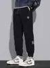 Pantalones gruesos de forro polar para hombre de marca de moda transfronteriza, pantalones casuales de retazos para otoño e invierno, pantalones cargo casuales de pana