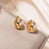 Diseño de orejera con forma de gota transfronteriza Explosiones europeas y americanas Pendientes de viento frío de alta gama Diseño de nicho ins para mujer Sentido del diseño