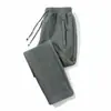 Calça casual masculina 2024 outono e inverno nova forrada com fleece espessa estilo coreano bolso na ponta do pé zíper calça plus size geração