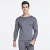 Nuevo traje de ropa interior térmica de terciopelo dorado para hombre y mujer con forro polar a prueba de frío ropa de otoño para parejas pantalones largos engrosados