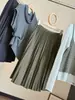 Saia Plissada Petite de Cintura Alta para Mulheres Outono/Inverno 2026 Nova Retro Versátil Emagrecedora Elegante Midi de Corte A