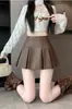 Falda plisada retro de cuero de cintura alta 2026 Otoño/Invierno Nuevo Diseño Casual Estilo Coreano Sentido del Diseño Adelgazante Falda Súper Corta Chica Picante
