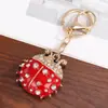 Nuevo Llavero de Coche Mariquita Roja de Siete Estrellas con Diseño de Metal y Pedrería, Llavero Escarabajo Colgante para Mochila