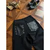 Luz Negra Lujo Retro Pierna Ancha Pierna Recta Cinco Botones Corte Tridimensional Silueta Retazos Bolsillo de Cuero Jeans de Mezclilla Hombre