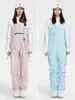 Liquidación de pantalones de esquí tipo peto para mujer, nuevos, impermeables y cálidos, chaqueta de esquí profesional para hombre, comercio exterior