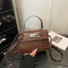 Bolsa de Ombro/Transversal Kelly Feminina Moda Verão 2026 Padrão Crocodilo Texturizado Grande Capacidade Simples Elegante para o Trabalho