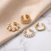 Nuevo juego de cuatro piezas de clip para oreja de perla de lujo ligero de moda transfronteriza de Amazon, pendientes versátiles y elegantes para mujer