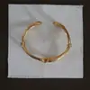 Pulsera abierta de múltiples hilos retorcidos, de moda europea y americana, para mujer, diseño de nicho de lujo ligero, estilo metálico, exquisita y versátil para el uso diario