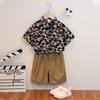 Fábrica de Roupas Infantis Cadeia de Suprimentos Camisa Floral de Manga Curta Infantil para Meninos e Meninas Camisa Havaiana de Férias Estilo Hong Kong Conjunto de Camisa e Shorts