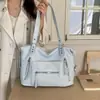 Bolsa de mano retro americana transfronteriza para motocicleta para mujer, primavera 2026, gran capacidad, bolso casual de hombro y axila a la moda, moderno