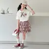 Conjunto de Verano para Niña con Polo de Cuello Estilo Universitario de Manga Corta, Nuevo Conjunto de Dos Piezas de Falda Tartán 'Pastel' de Verano Tendencia 2026