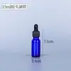 Botella rociadora de vidrio oscuro azul botella con dispensador de loción botella de esencia botella cuentagotas botella de cosméticos botella de perfume al por mayor