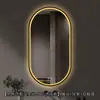 Espejo de baño inteligente ovalado en stock con lijado exterior e iluminación LED translúcida, adecuado para montaje en pared de baño y proyectos hoteleros, con opciones de personalización.