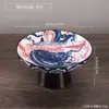 Plato de postre pintado en azul y blanco con pie alto, plato para frutos secos y pasteles de salón de té, plato pequeño de cerámica para frutas para uso doméstico, plato de té y postre para ofrendas budistas
