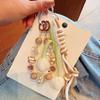 Nuevo Llavero de Moda Transfronterizo de Cuerda Tejida Exquisito Versátil Colgante para Bolso Soporte para Teléfono con Cuentas Pintado a Mano Venta al por Mayor