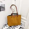 Bolso Cubo Portátil de Contraste de Color Retro Francés Transfronterizo Nuevo para Mujer Otoño e Invierno Versátil para el Trabajo y los Viajes Bolso Cruzado
