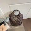 Bolso de hombro versátil de moda transfronterizo con un toque de alta gama, adecuado para ir al trabajo, bolso tipo cubo vintage, bolso de mano acolchado simple casual